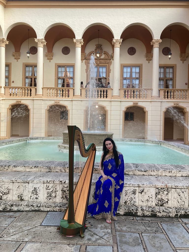 Harpist AnnaLisa performs on harp at Indian wedding Ritz-Carlton Key Biscayne Florida